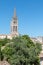 View of French village Saint Emilion dominated by spire of the monolithic church France