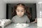 View from fridge, joyful child girl found cakes