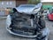 View of the front of a car badly damaged during a car accident. In this condition, the car is immovable and very