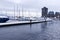 A View of frozen dock with boats in Coal Harbour. Snow storm and extreme weather in Vancouver.