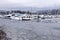 A View of frozen dock with boats in Coal Harbour. Snow storm and extreme weather in Vancouver.
