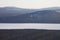 View of frozen lake from mountain range Zyuratkul. Ural landscap