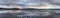 View of a frozen Yellowstone Lake with snow covered mountains in American Landscape.