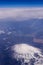 view of fuji mountain and wing of the air plane from window airplane with Aerial view background, Yamanashi, Japan