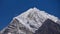View of full moon rising above impressive snow-capped mountain Tengi Ragi Tau near Thame, Himalayas, Nepal.