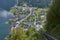 View of a funicular rail leading to a skywalk view in Austria with hallstatt village in the background.