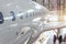 View of the fuselage of a passenger airliner with portholes and a wing with a landing gear in a repair hangar for aircraft