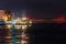 View of Galata quarter on the Bosporus and a bridge in the distance at night. Istanbul.