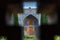 View of Garden through the window in Shah Mosque or Imam Mosque in Isfahan. Iran