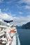 View of Geirangerfjord Norway from rear of cruise ship Magellan with lifeboats and funnel