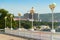 View from the Gelendzhik embankment to the coast, the sea pier and the hotel under construction. Green trees on the