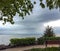 View on Georgian Bay from wooden bench under birch tree at Sunset Point Park in Collingwood