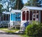 View of german camping place with tents, caravans, trailer park and cabin cottage houses