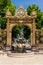 View of a gilded wrought-iron gate and Rococo fountain in the Stanislas Square of Nancy