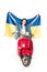 View of girl sitting on red scooter and holding Ukranian flag isolated on white