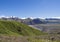 View on glacier lagoon with icebergs and tongue of Skaftafellsjokull, colorful rhyolit mountains in Skaftafell