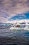 View of Glacier Lagoon with icebergs and zodiac touristic boats for the lake tour, Jokulsarlon, Iceland