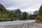 View on glacier from river bench. Forest, stones