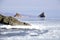 View from the glass bay to the cape three brothers. Frozen Japanese sea with floating ice, Vladivostok, Russia.