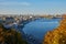 View from the Glass Bridge to the city center, road, cars. Public transport. View of the Dnieper river with rocks, green hills and