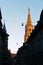 View of gold color Cathedral of Bern and silhouette of street at sunset in the historic city of Bern.