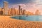 view of the golden sand illuminated by the setting sun in the JBR beach area. Amazing skyscrapers and warm waters of the