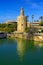 View of Golden Tower Torre del Oro of Seville, Andalusia, Spain over river Guadalquivir