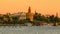 View of Golden Tower Torre del Oro of Seville, Andalusia, Spain over river Guadalquivir at sunset