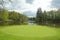 View of golf course, circle part surrounded by water