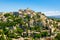 View on Gordes, a small typical town in Provence, France. Beautiful french village, with view on roof and landscape on
