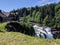 View of the gorgeous Snoqualmie Falls with Salish Lodge and Spa in the background, on a beautiful summer day