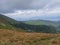 View from grassy hill slopes of hiking trail from Chopok at mountain meadow landscape of ridge Low Tatras mountains