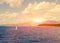 View of the Greek island and little yachts from the ship ferry. Sunset background.