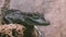 View of green crocodile sitting in transparent aviary. Dangerous animal. Predator