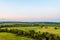 View of green forest-steppe plain. Flatland valley in evening time.