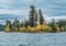 View of Green Lake in Cariboo surrounded by yellow and green trees in gloomy day, British Columbia