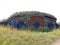 View of green plants and old stone barn, Suomenlinna, Helsinki