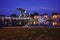 View of the Greifswald sailing harbor with the historic drawbridge and reflecting lights at the blue hour