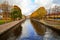 View of the Griboedov canal and the yellow trees with the Staro-Nikolsky bridge in autumn