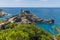 A view from the grounds of Doria Castle towards the promontory of the church of Saint Peter in Porto Venere, Italy