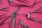 View on group different surgical steel instruments and hyaluronic acid syringe on pink background - cosmetic surgery and wrinkle