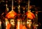 View on group of isolated red yellow shiny glowing wine glasses in cupboard