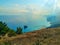 View of the Gulf of Antalya from Tunek Tepe hill with a small island in the Mediterranean in a haze. Beautiful seascape with