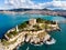 View of Guvercinada or Pigeon Island in the Aegean Sea with the Kusadasi Pirate castle in summer day,