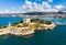 View of Guvercinada or Pigeon Island in the Aegean Sea with the Kusadasi Pirate castle in summer day,