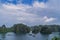 View of the Ha Long Bay with green rocks and floating boats, Vietnam