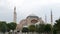 View of the Hagia Sophia in Istanbul, Turkey over which seagulls fly. The historical temple of various religions of