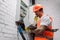 View of handsome electrician taking off