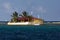 View of Happy Island, a Tiny Brightly Coloured Island Restaurant with Palm Trees; the Grenadines, Eastern Caribbean.