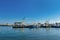 View on harbor with several anchored boats on island Texel on summer day with blue sky